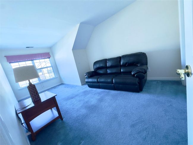 2nd Floor Bedroom featuring lofted ceiling, baseboards, visible vents, and carpet flooring | Image 13
