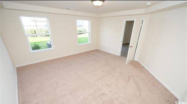 Spare room with baseboards and light carpet | Image 14