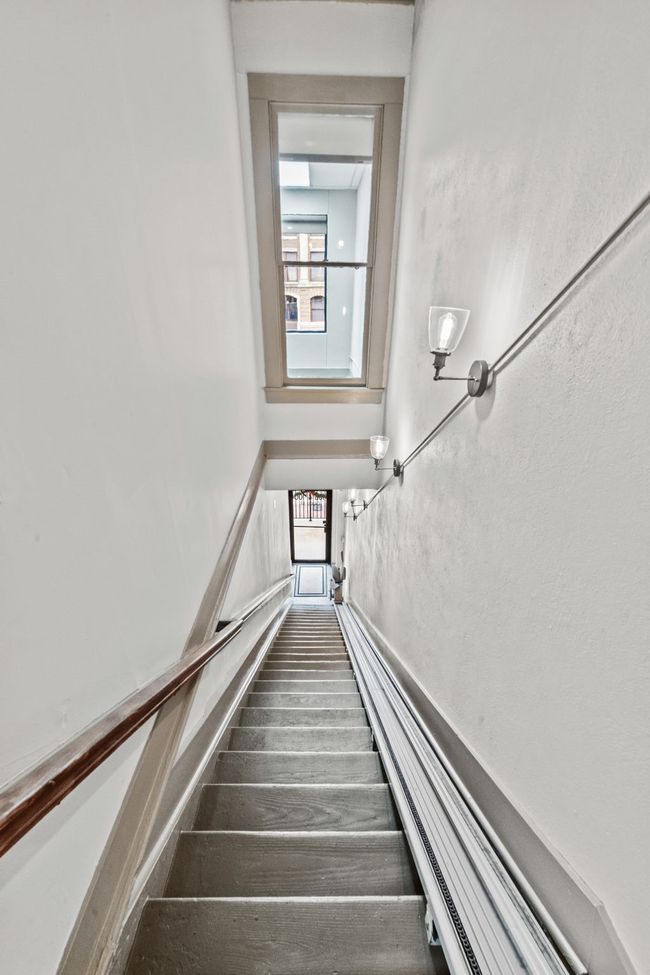 Hall featuring dark wood-style floors, recessed lighting, and a drop ceiling | Image 4