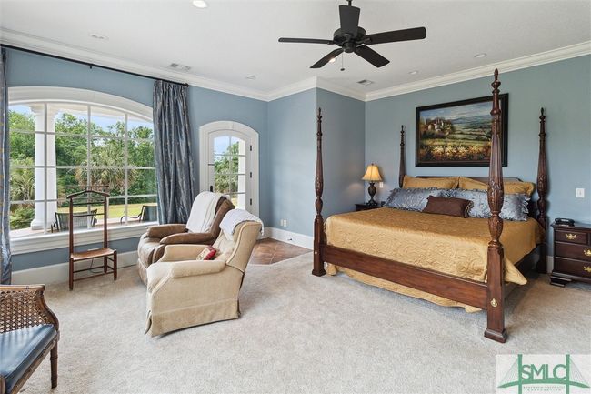 Upstairs, the primary suite encompasses the entire left hand side of the home. | Image 21