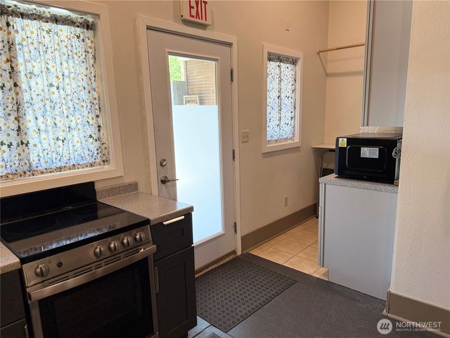 back door leads to covered parking/pati | Image 23