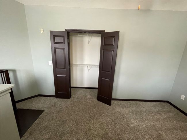 Unfurnished bedroom featuring carpet flooring and baseboards | Image 22