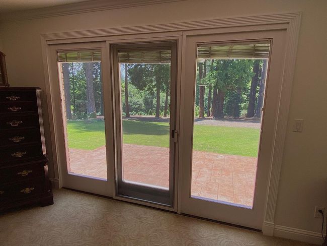 View from Master on main floor. Private back patio has spa outside. Christmas trees below. | Image 29