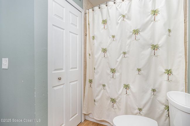 Upstairs Bathroom with Dual Sinks, Solid Surface Countertops & Shower/Tub Combo | Image 23