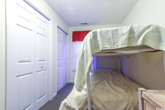 Bedroom featuring carpet flooring | Image 16