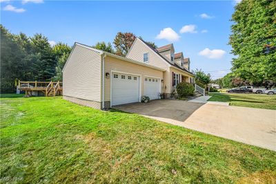 View of home's exterior featuring a garage and a yard | Image 3