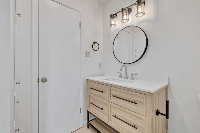 Bathroom featuring vanity | Image 13