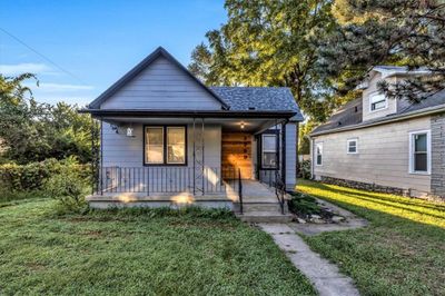 Bungalow-style home with a front yard and a porch | Image 1