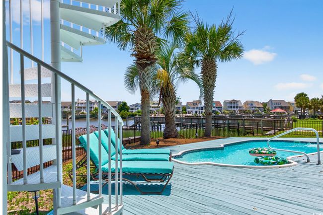 View of swimming pool with a residential view and a deck | Image 34
