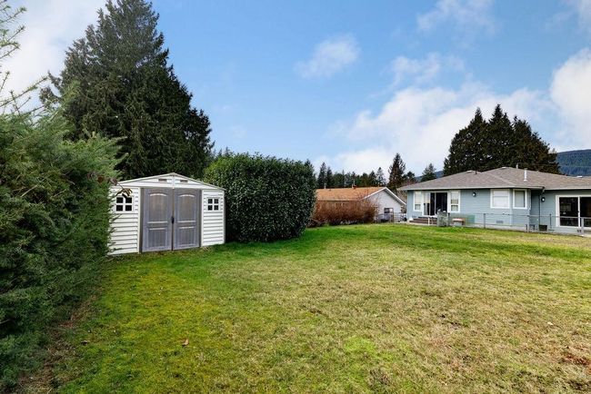 View of yard with an outdoor structure and a shed | Image 28