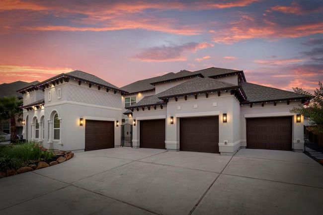 Boasting a hard-to-find 4-car garage with durable epoxy floors, this standout property is one you won’t want to miss! Plenty of parking for the entire family! | Image 46