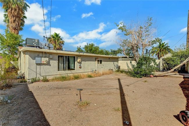 View of front facade with stucco siding and solar panels | Image 40