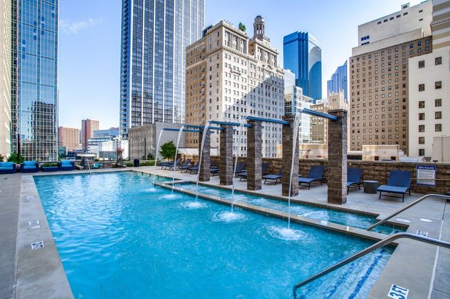 Pool featuring a skyline view and a patio | Image 11