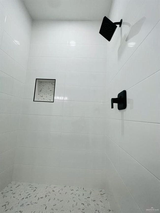 Bathroom with a tile shower | Image 24