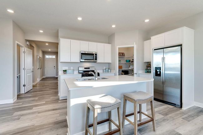Corner pantry for extra storage. Photo is of a previously built model home, finishes and selections will vary. | Image 4