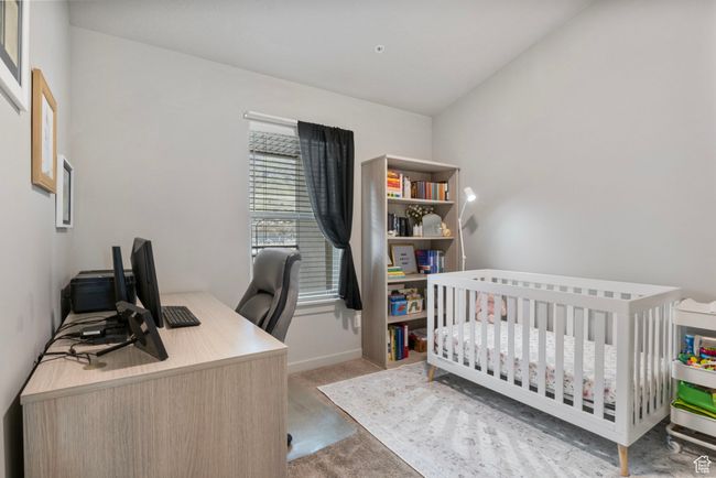 Carpeted bedroom with baseboards | Image 18
