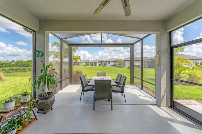 Covered , extended and screened patio. Do notice the panoramic screening (no ee'um) that brings huge greenway views | Image 28