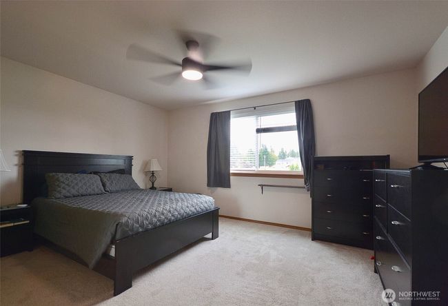 Primary suite offers lots of room with celling fan and huge walk-in closet, 5 piece primary bathroom with soaking tub and stand alone shower , potty room, double sinks. | Image 24