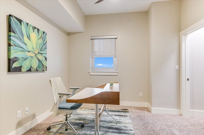 Second bedroom or home office featuring ceiling fan, baseboards, and carpet. | Image 13