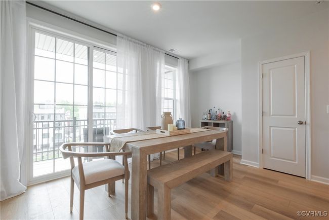 Dining area with baseboards, light wood-style floors, visible vents, and plenty of natural light | Image 17