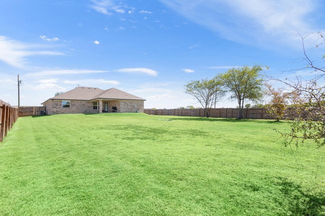 View of fenced backyard | Image 29