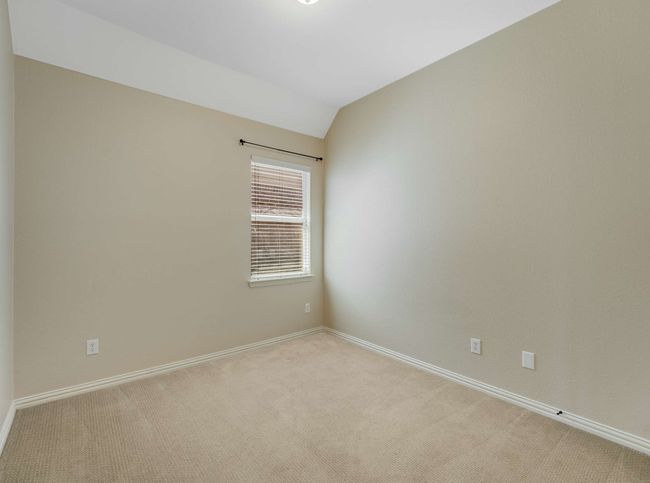 Carpeted spare room with baseboards and lofted ceiling | Image 29