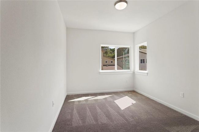 Carpeted spare room with baseboards | Image 23