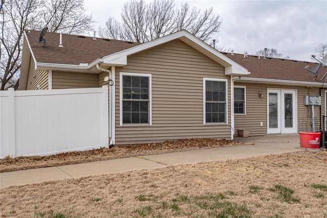 Back of house with a patio, fence, french doors, and roof with shingles | Image 38
