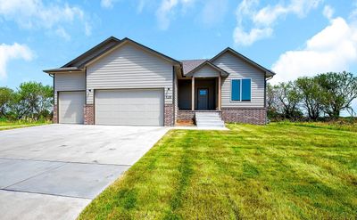 View of front of property with a garage and a front yard | Image 1