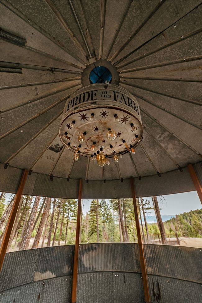 The silos make for a fun, peaceful entertainment area have custom UL certified light fixtures, all from slavaged and restores farm implements. They are an unexpected delight every time you look up. | Image 41