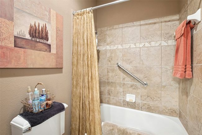 Bathroom featuring shower / tub combo with curtain | Image 21
