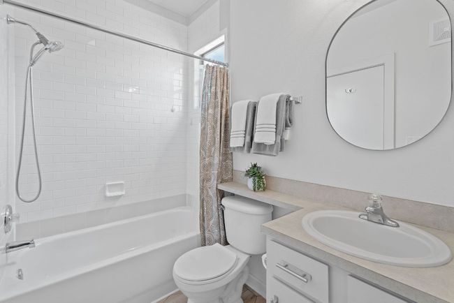 Bathroom with vanity and shower / tub combo | Image 24