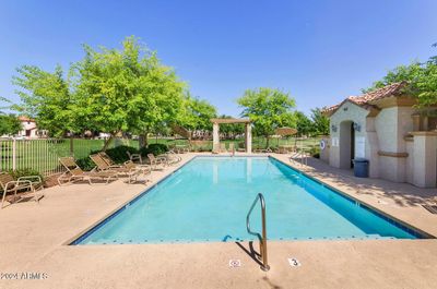 Higley Park Community Pool is a vibrant oasis featuring crystal-clear waters and spacious lounging areas, perfect for families and friends. | Image 2