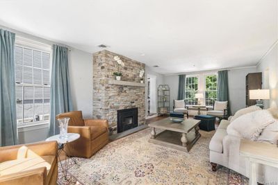 Oversized living room with wood burning fireplace | Image 3