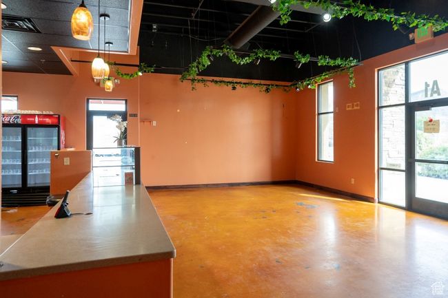 Interior space with baseboards and finished concrete floors | Image 18