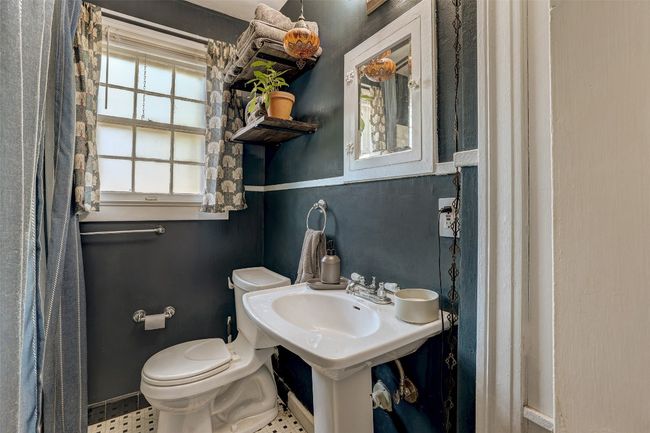 Bathroom featuring toilet and baseboards | Image 18