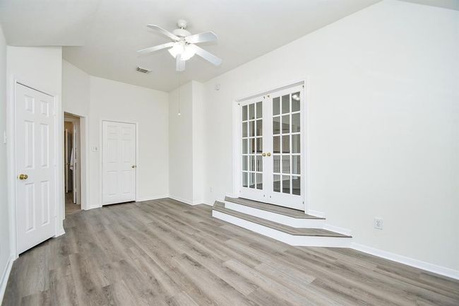 Bedroom #2 is also open to your game room, making it an ideal spot to convert to a media room or cozy hangout area if you so wish. | Image 27