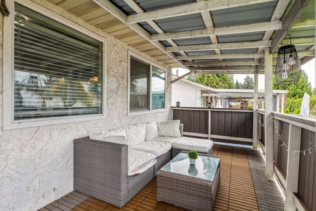 Wooden terrace featuring an outdoor hangout area | Image 32
