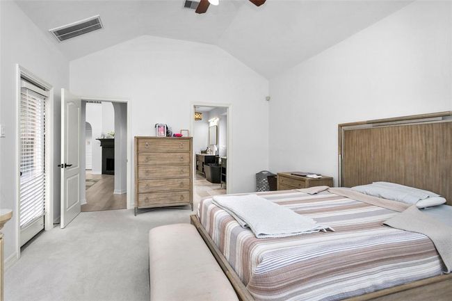The primary bedroom is located on the 1st floor with high ceilings continuing through. | Image 21