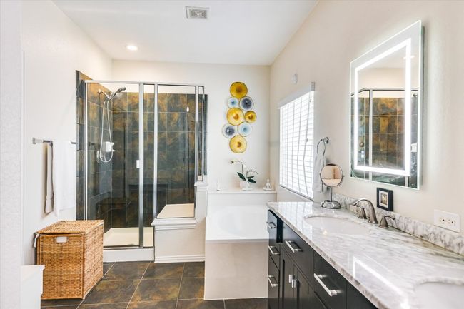 Great main bathroom with double sinks. The master closet is off of this room. | Image 12