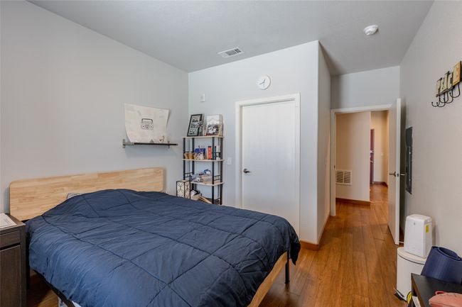 Bedroom with wood finished floors | Image 21