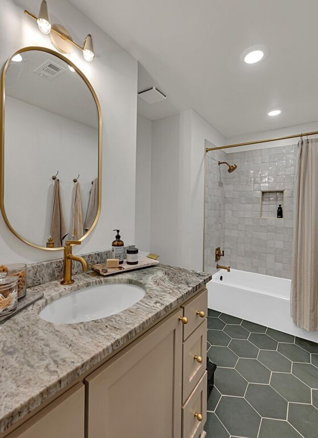 Full bath featuring vanity, tile patterned floors, shower / bath combo, and recessed lighting | Image 30