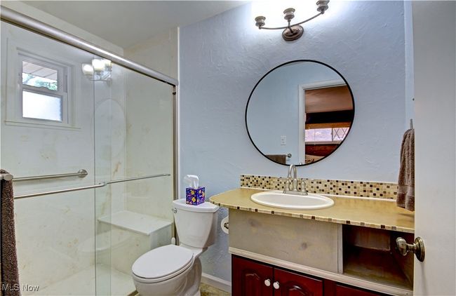 Full bathroom featuring vanity and a shower stall | Image 29