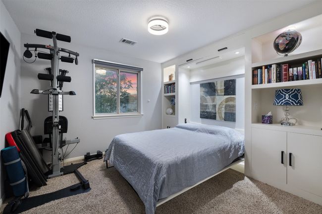 Spacious secondary bedrooms with large closets and Murphy bed. | Image 23