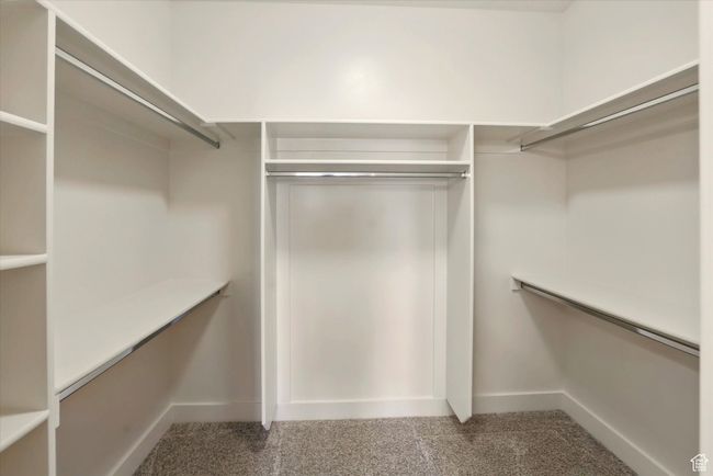 Walk in closet with carpet floors | Image 19