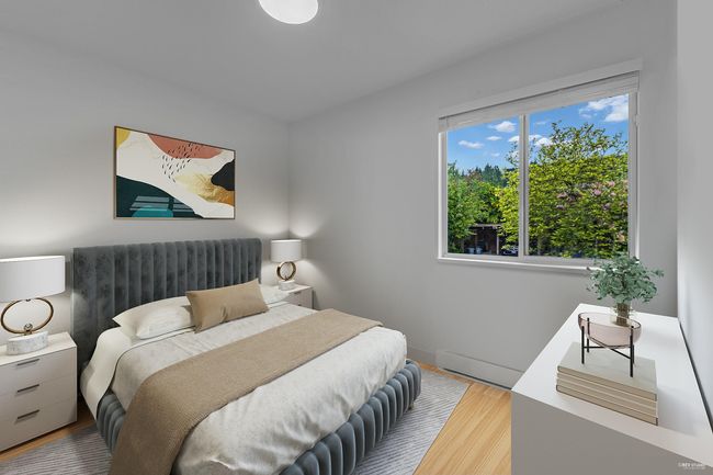 Bedroom featuring wood finished floors and baseboards | Image 21