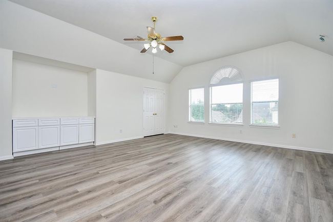 Welcome to your expansive 18' x 20' game room on the second floor—an ideal space for movie marathons, game nights, or a cozy lounge area. Note this room is wired for surround sound system that enhances the movie theater experience. With plenty of room for a sectional, media setup, or play zone, this versatile room is ready for fun and relaxation! | Image 24