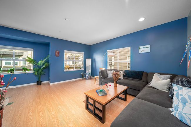 Living area featuring baseboards, recessed lighting, light wood-style floors, and plenty of natural light | Image 21