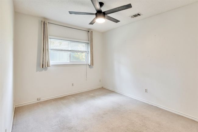 Spare room featuring carpet flooring and a ceiling fan | Image 8