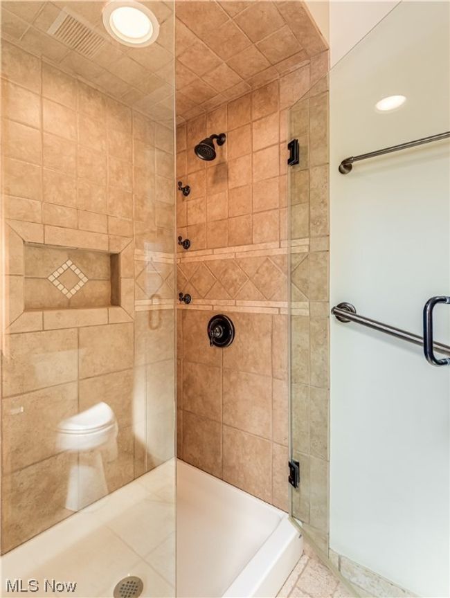 Primary Bathroom featuring tiled shower | Image 8